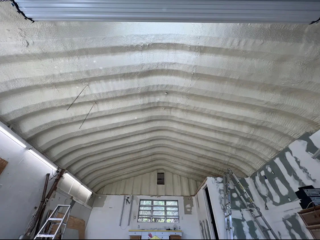 Spray polyurethane foam applied to the underside of a metal roof deck in Petoskey